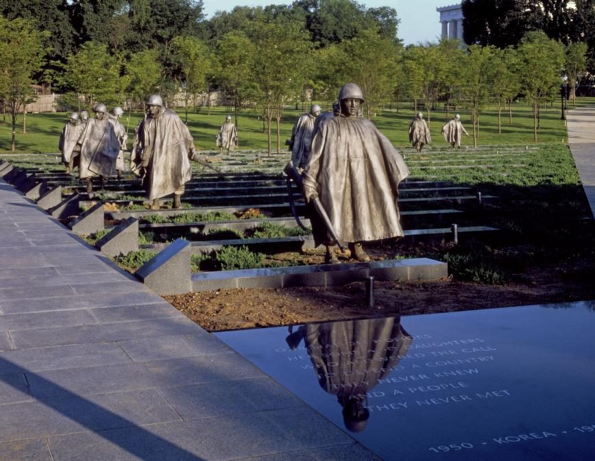 The Field of Service soldier statues advancing through the Korean War Veterans Memorial.